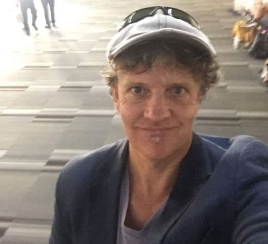 Jaime Terauds, wearing one of the caps the bio mentions